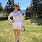 Woman wearing the Solace UPF 50+ long sleeve golf polo on an Okanagan golf course — Enjoy the Vu sun protection golf apparel