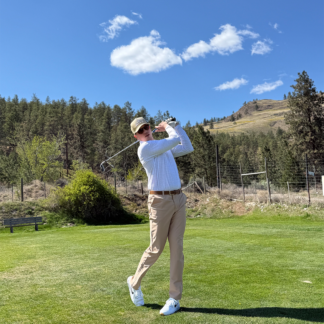 Man wearing the Solace UPF 50+ long sleeve golf polo on an Okanagan golf course — Enjoy the Vu sun protection golf apparel
