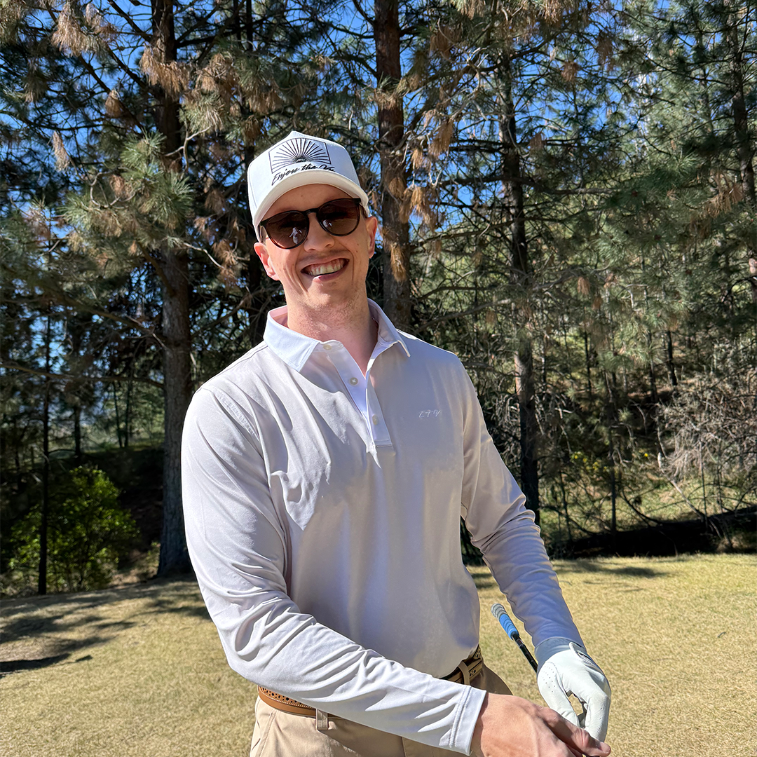 Man wearing the Sahara UPF 50+ long sleeve golf polo on an Okanagan golf course — Enjoy the Vu sun protection golf apparel
