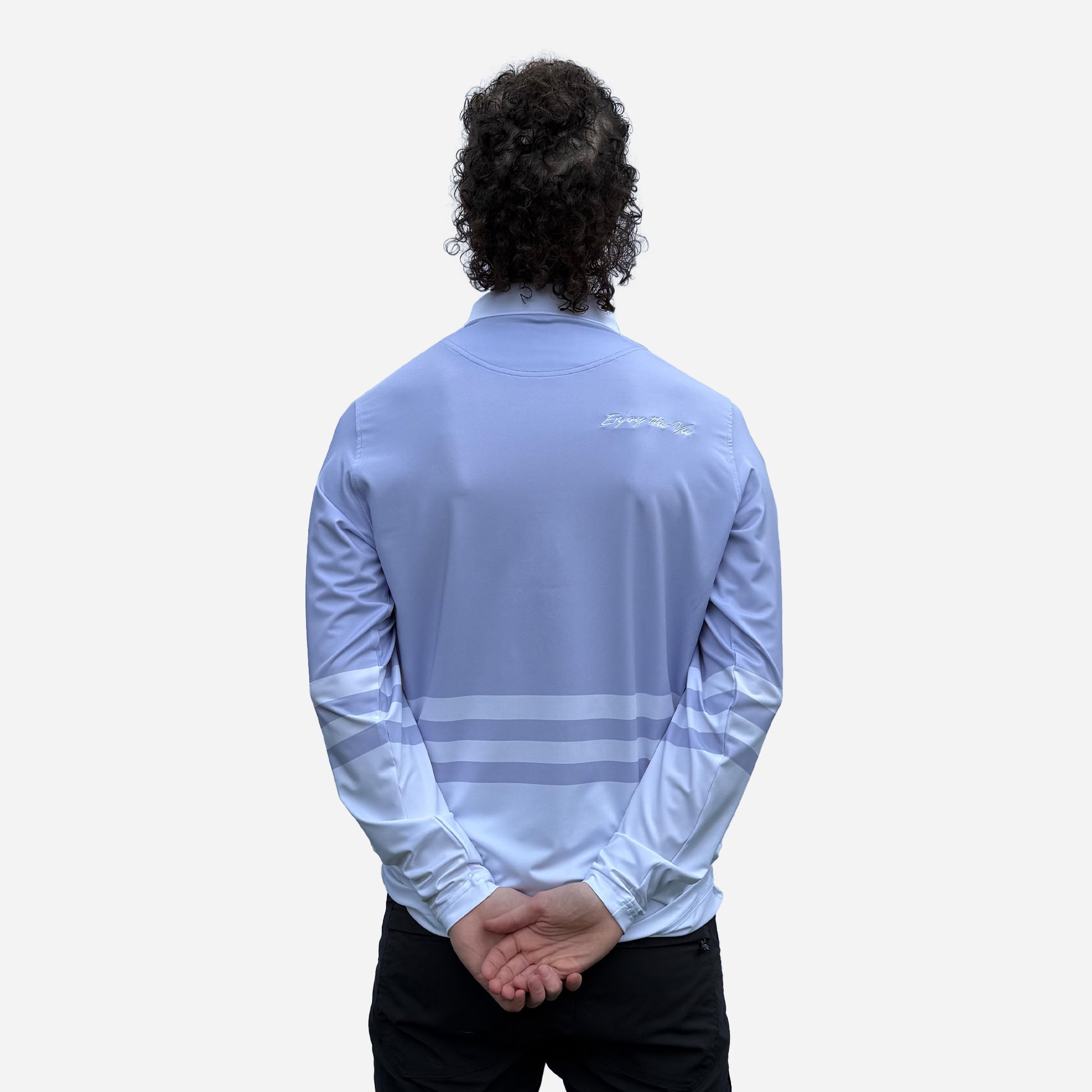 Man wearing a lavender UPF 50+ long-sleeve polo shirt with white stripes on a plain background shot from the mans back.