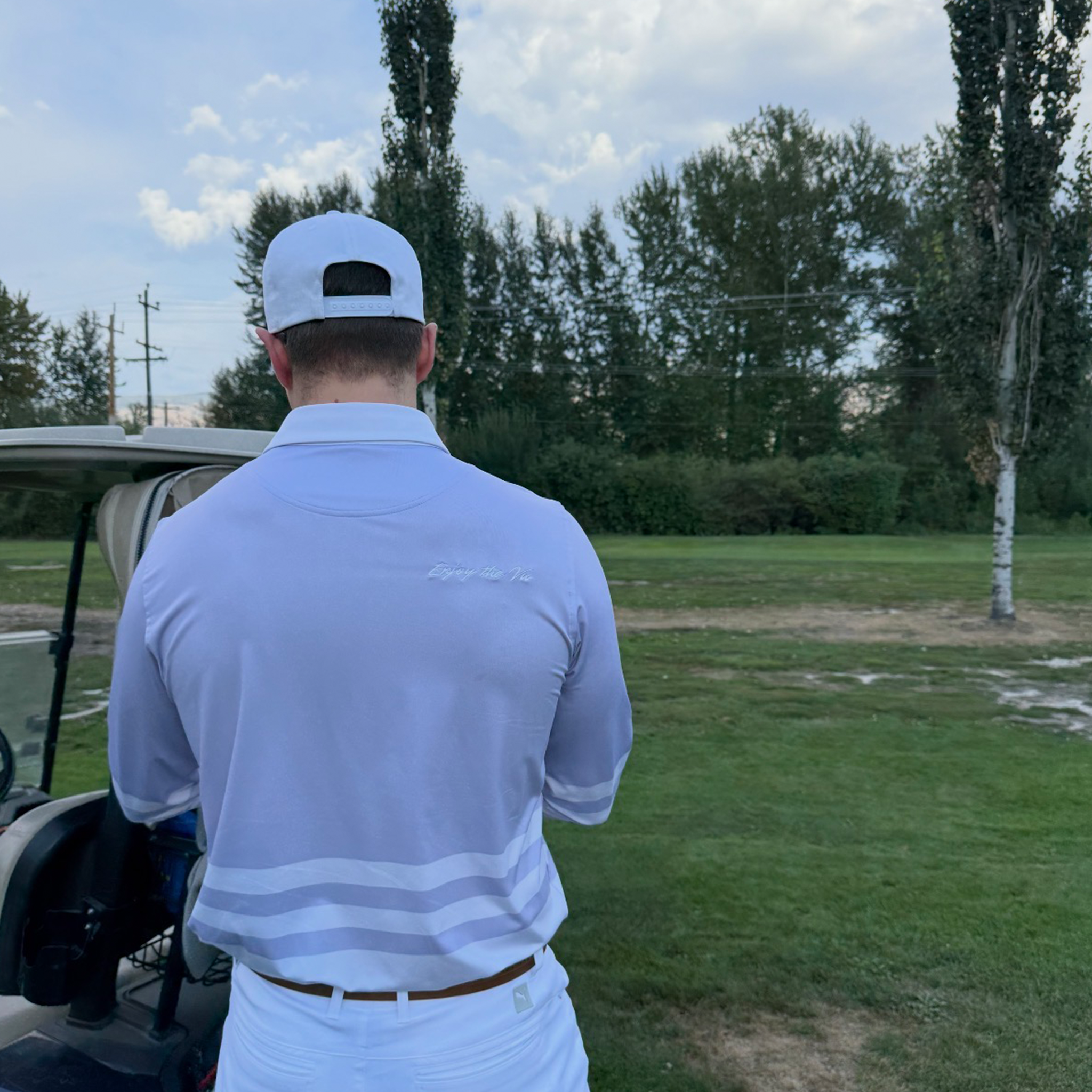 Man wearing the Lavender UPF 50+ long sleeve golf polo on an Okanagan golf course — Enjoy the Vu sun protection golf apparel