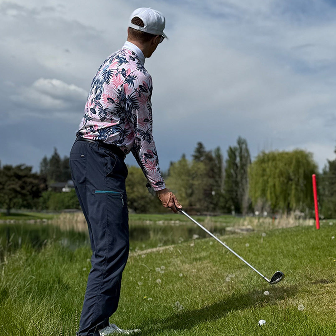 Man wearing the Tropical UPF 50+ long sleeve golf polo on an Okanagan golf course — Enjoy the Vu sun protection golf apparel
